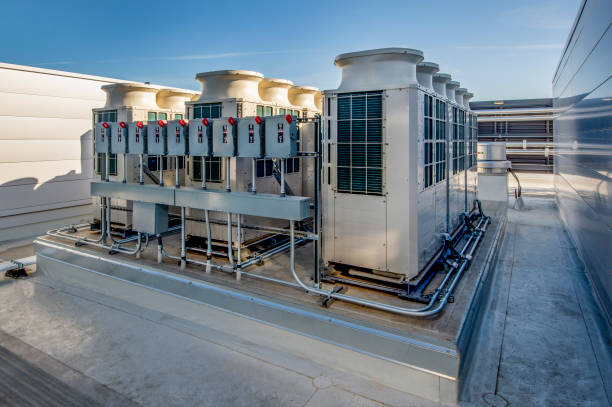 VRF system installation on a rooftop, showcasing multiple outdoor units with sleek design and efficient cooling technology, relevant to Dycus Heating and Air Conditioning's services in Modesto, CA.