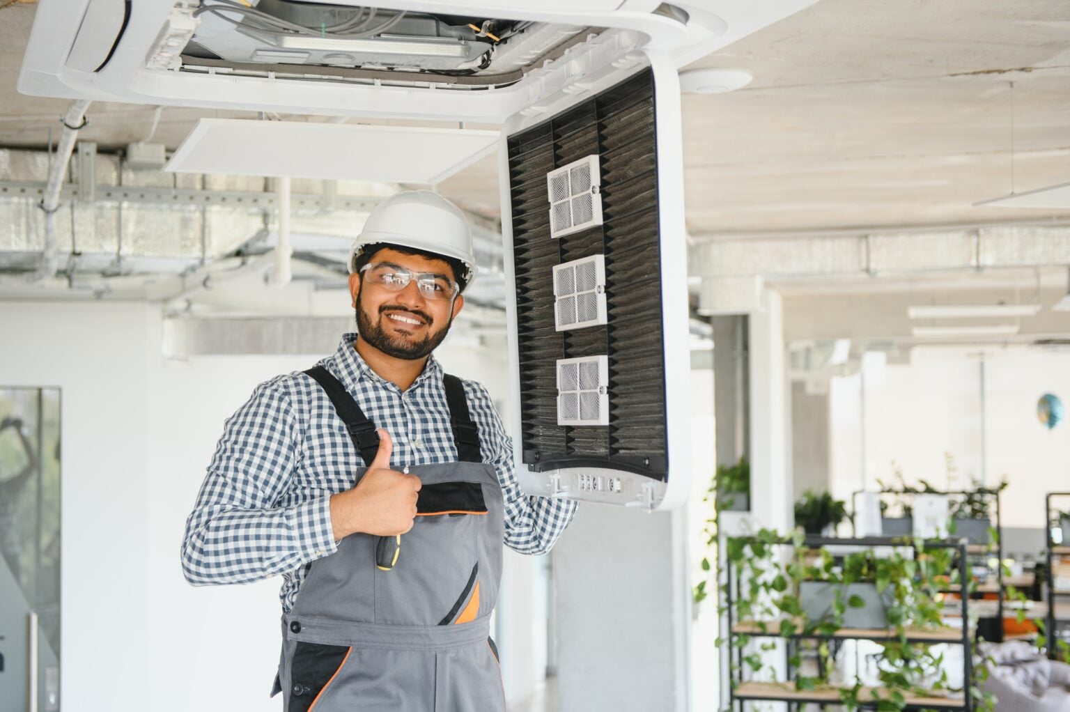 Technician repairing a residential air conditioner, AC repair and installation in Hughson, CA