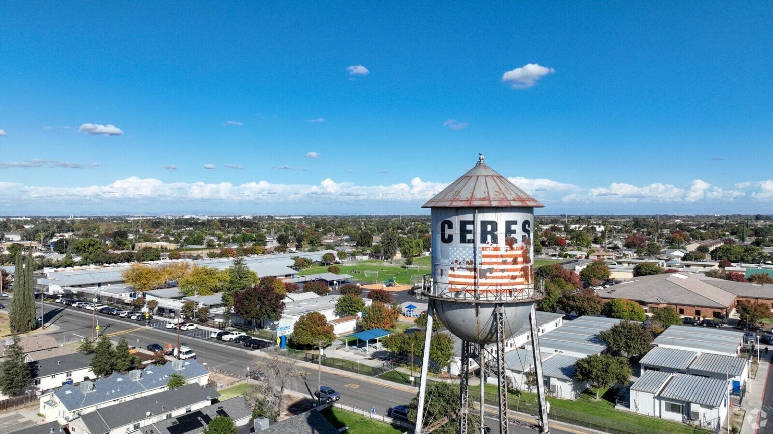 The Ceres water tower, painted with the town name and an American flag, above the neighborhoods Dycus Heating and Air Conditioning serves in Ceres, CA